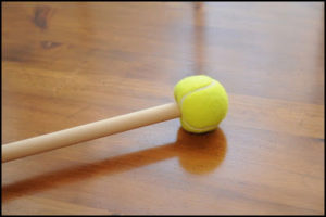 Pool stick with tennis ball on the end